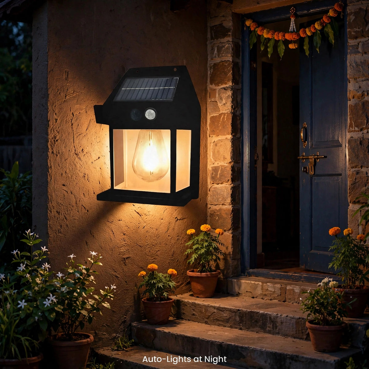 Lamp lit on home wall at night